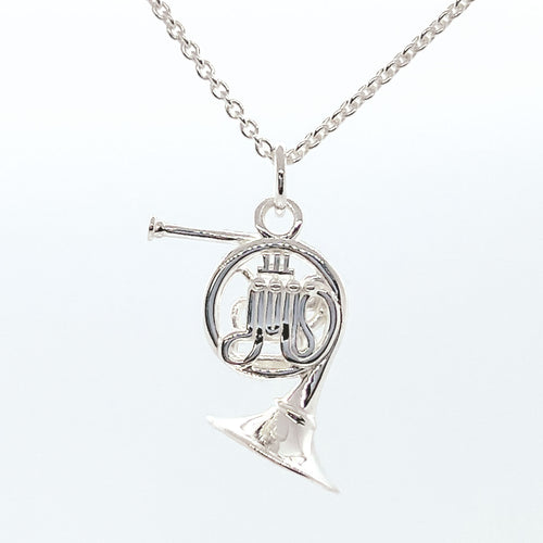 Sterling Silver French Horn necklace. Intricate detailing on both sides of pendant.