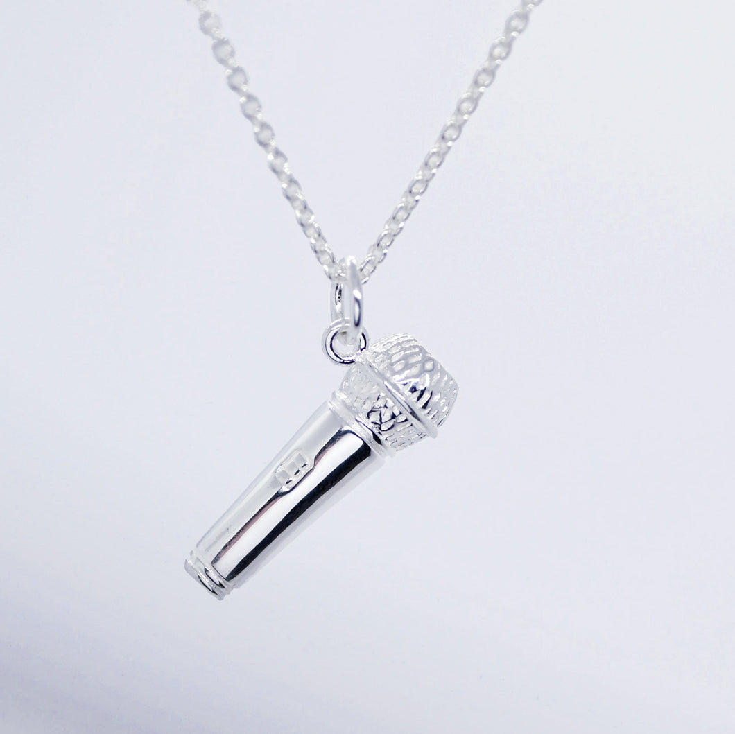 Our gorgeous Microphone Necklace is quite distinct in its level of detail and made of high quality .925 sterling silver especially for us by a renowned jewellery brand. The pendant's intricate details include the head screen and the control switch. We have delicately weighted the microphone so it points upwards as if capturing sound - ideal for vocal musicians. 
