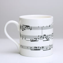 Load image into Gallery viewer, Elegant bone china mug with section of Bach&#39;s Fugue in A Minor for Organ printed on 