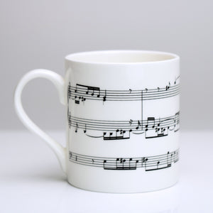 Elegant bone china mug with section of Bach's Fugue in A Minor for Organ printed on 