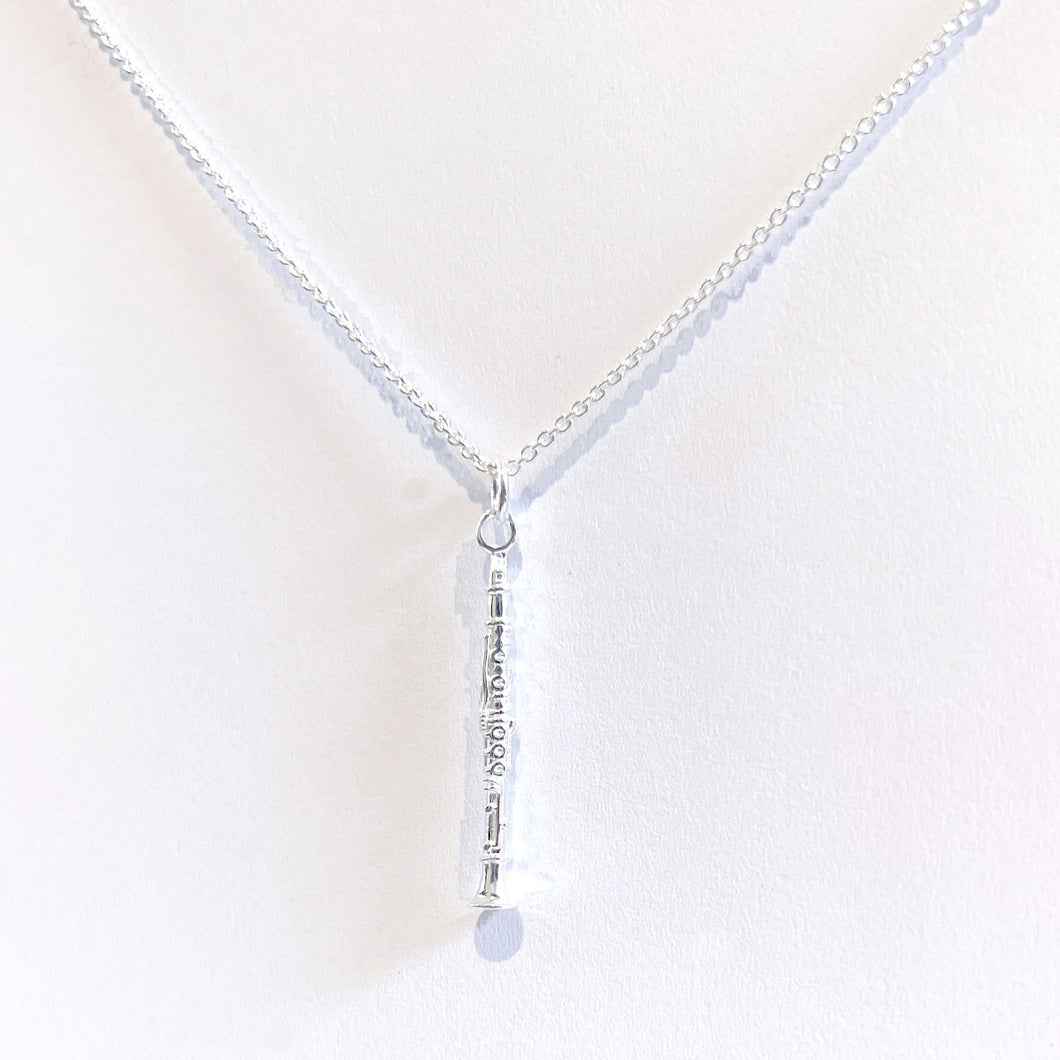 Sterling silver clarinet pendant necklace. Includes details that you would find on a full size Clarinet such as the mouthpiece, barrel, first joint, second joint, keys and bell.