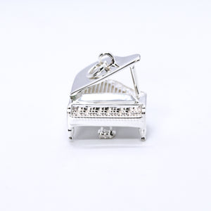 Sterling Silver Grand Piano Necklace. The Grand Piano pendant's intricate details include an accurate keyboard, strings, stand, pedals and lid.