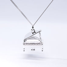 Load image into Gallery viewer, Sterling Silver Grand Piano Necklace. The Grand Piano pendant&#39;s intricate details include an accurate keyboard, strings, stand, pedals and lid.