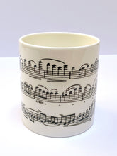 Load image into Gallery viewer, Music gift ideal for classical music fans. Elegant bone china mug with a section of Mendelssohn&#39;s Violin Concerto printed on in black. This fabulous mug is perfect for any violin player or music lover. A combination of a full capacity of 310ml and a subtle lip and classic handle design makes this mug both comfortable and stylish. Microwave and dishwasher safe. Height 85mm; Diameter 77mm. View from centre thechord.co.uk