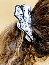Load image into Gallery viewer, Musical hair tie scrunchie. Black music score on White material.  Hand-made, large size (approx 15cm diameter). Shown on model.